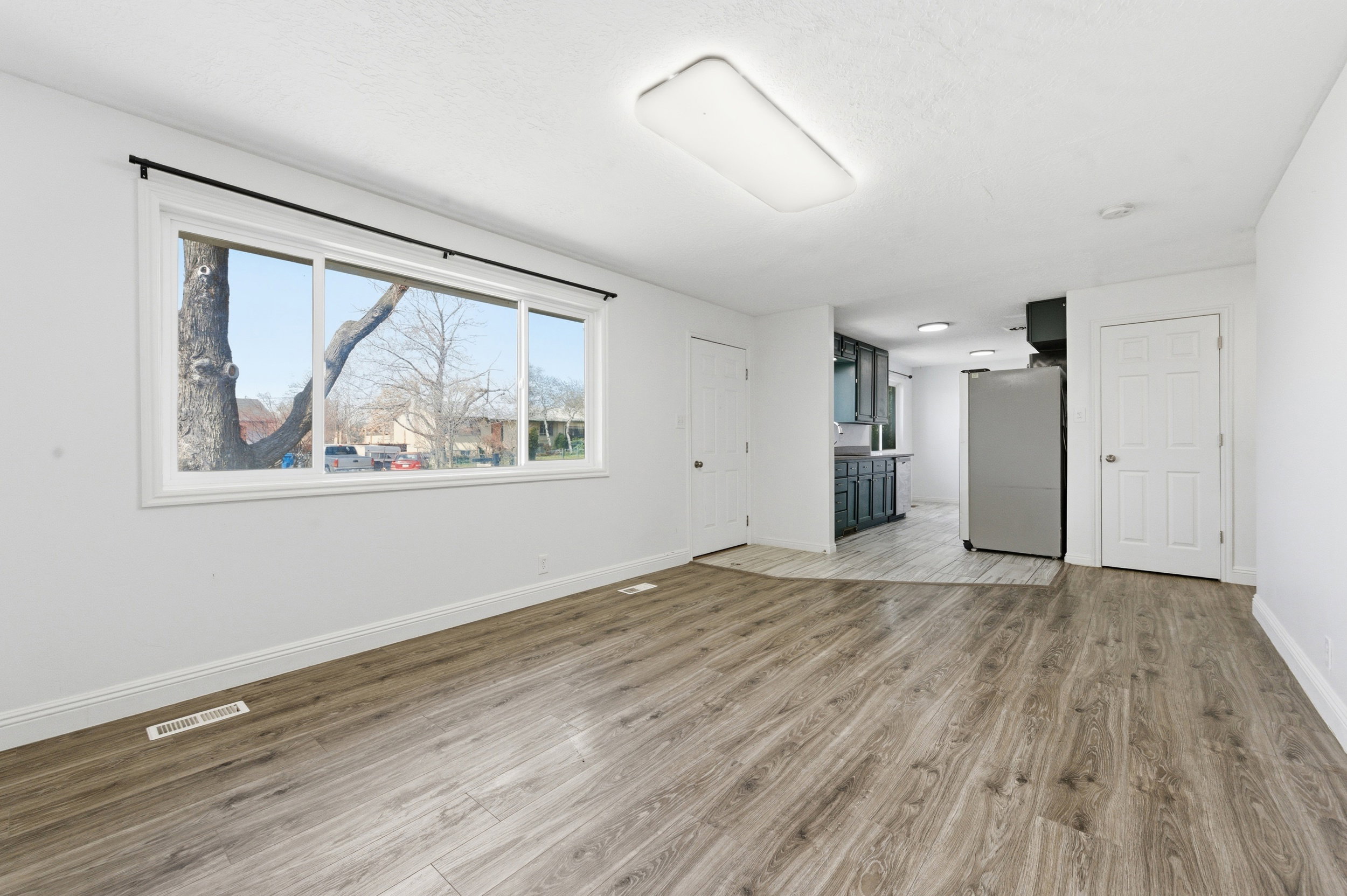 Unfurnished living room with light wood-style flooring