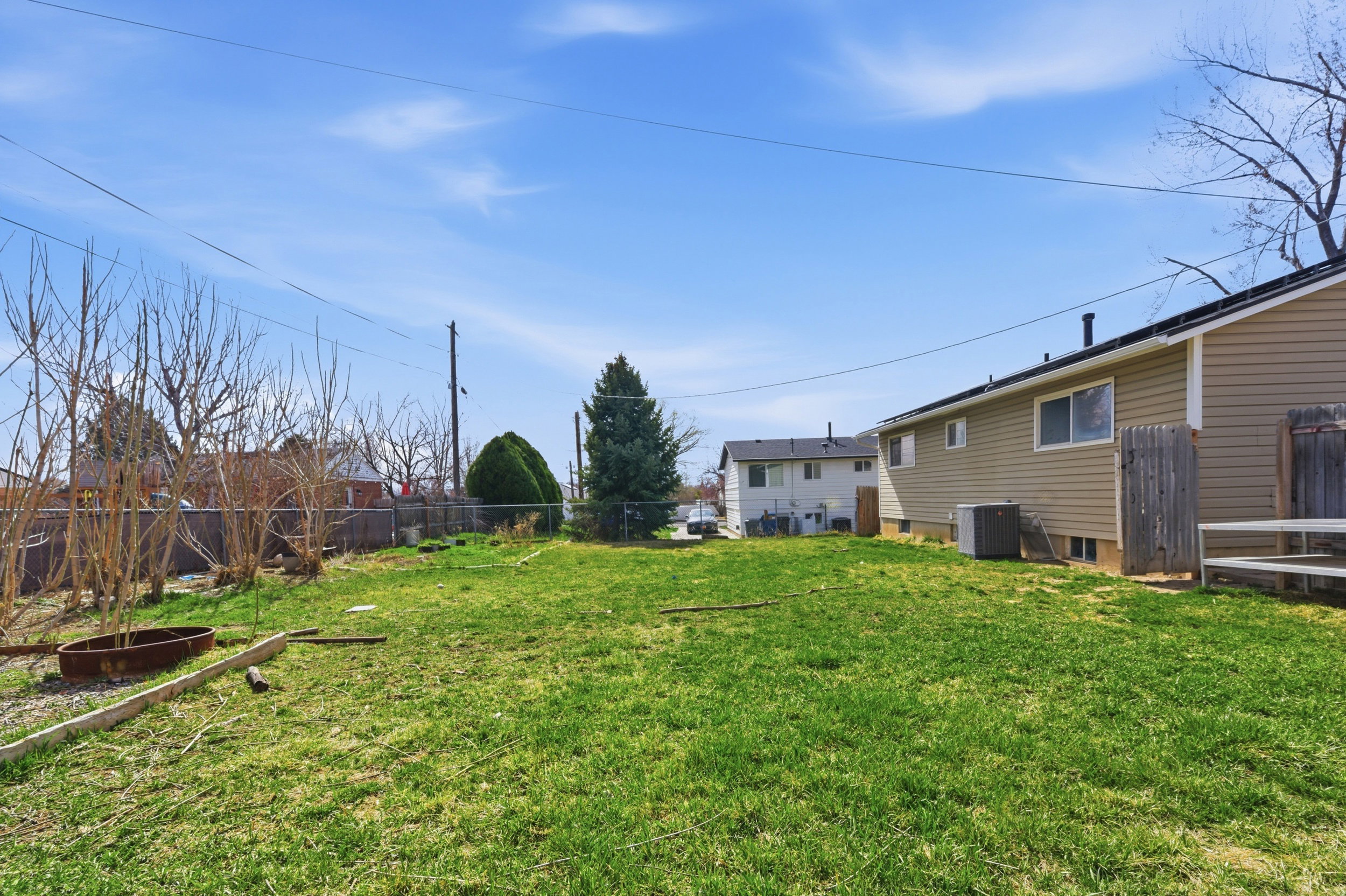 View of fenced backyard