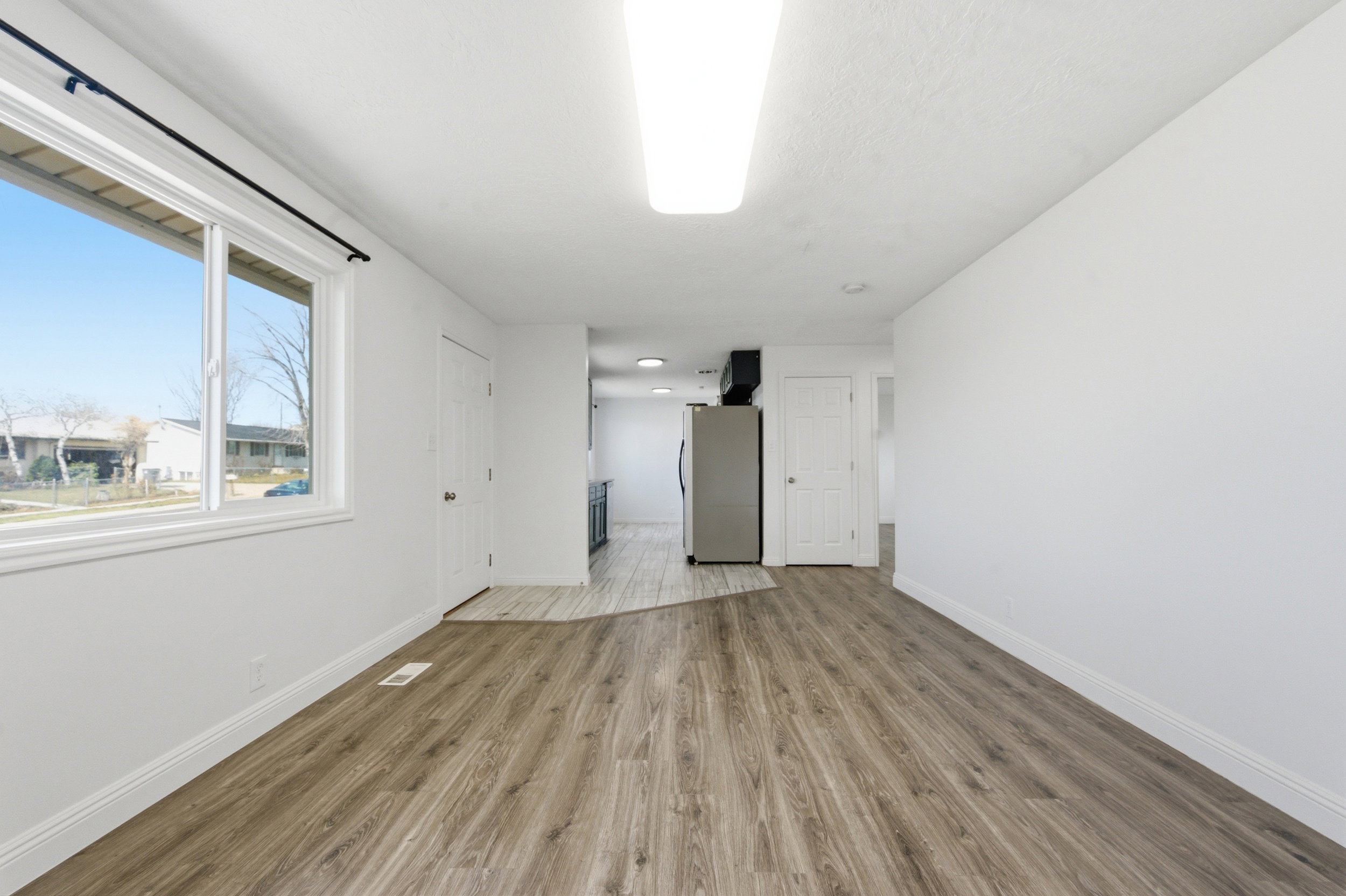 Empty room featuring light wood-style flooring and baseboards