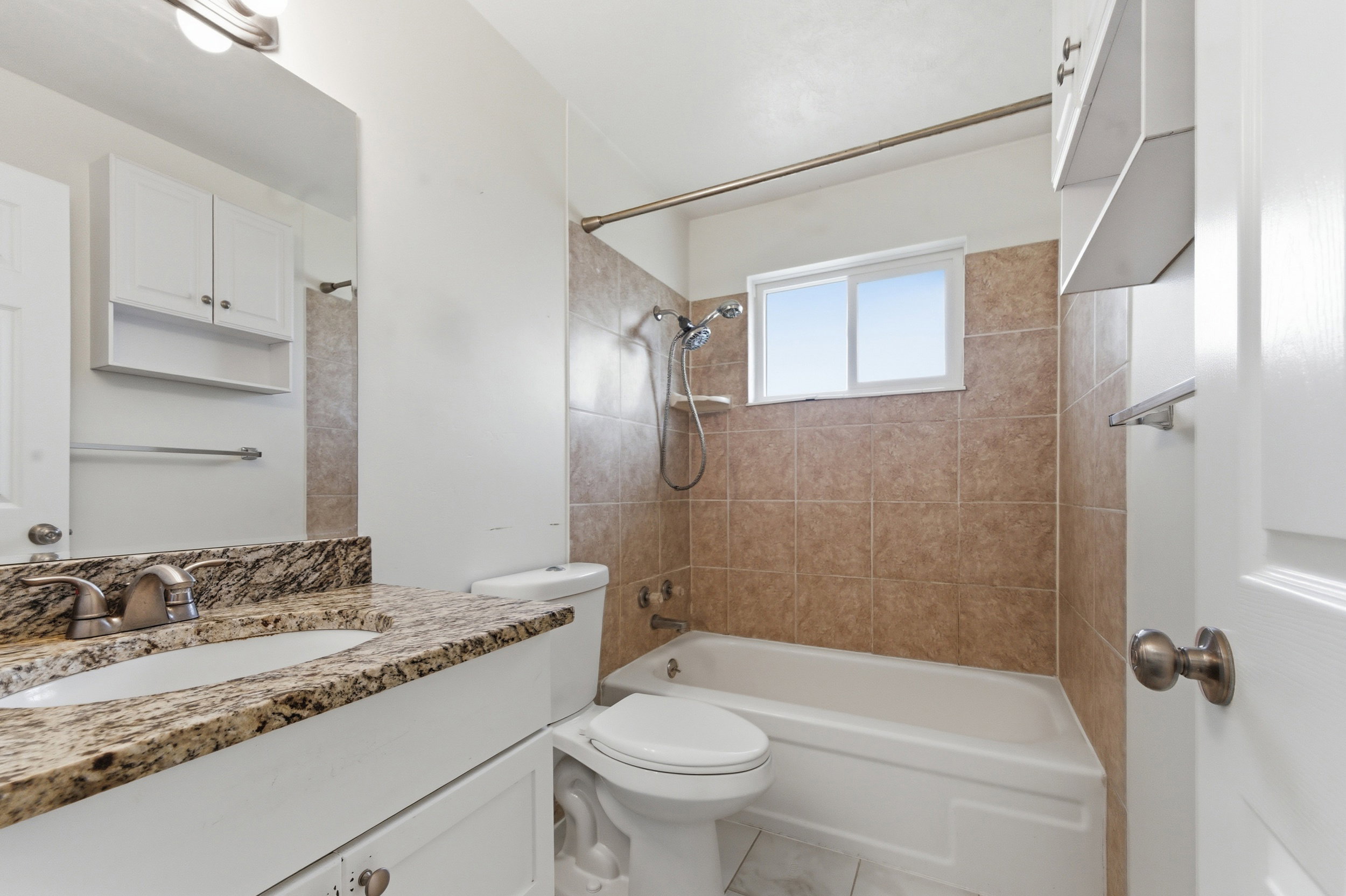 Bathroom featuring vanity and bathtub / shower combination