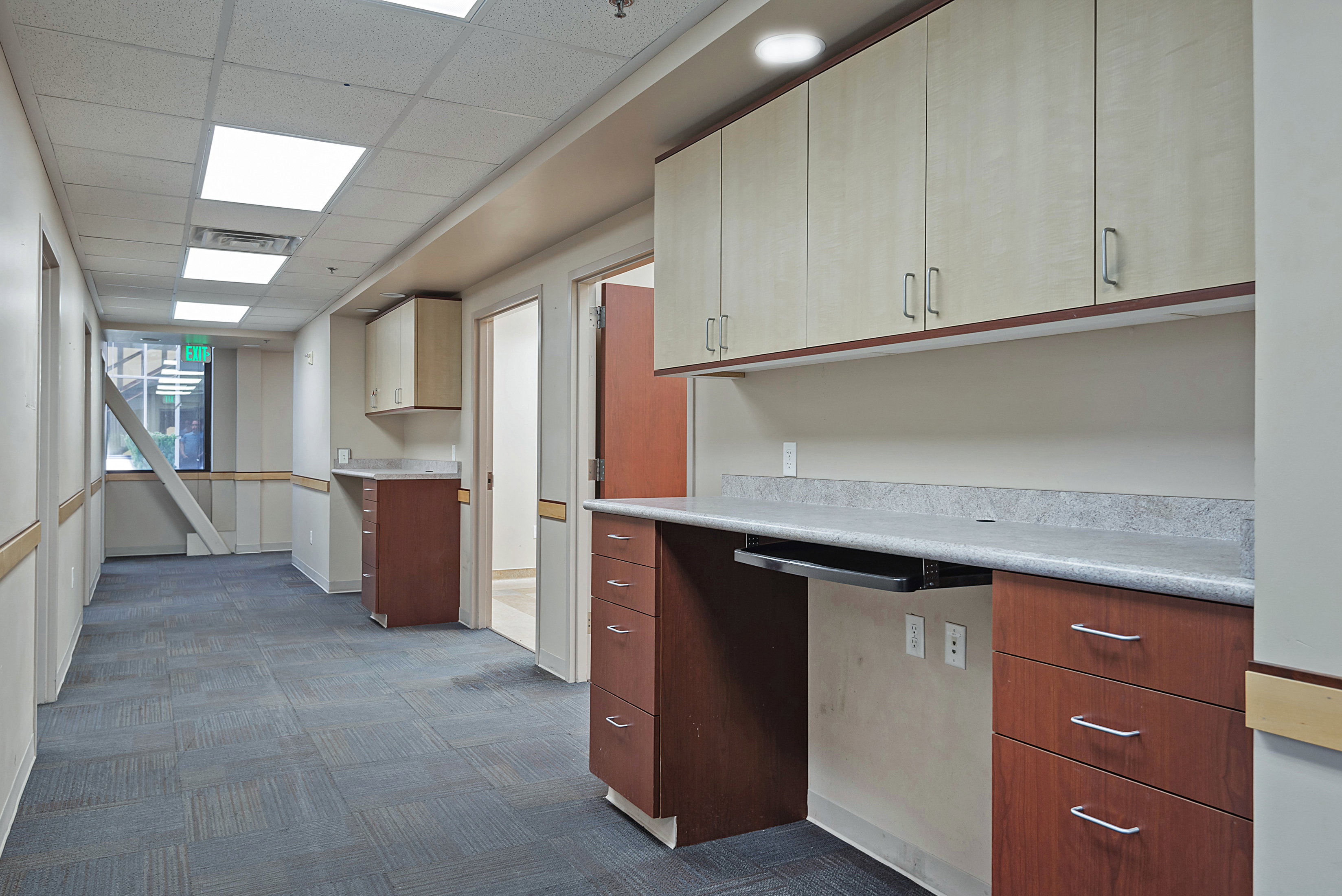 Kitchen featuring a drop ceiling and light countertops