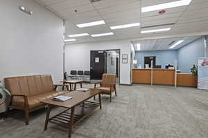Welcome area featuring a paneled ceiling