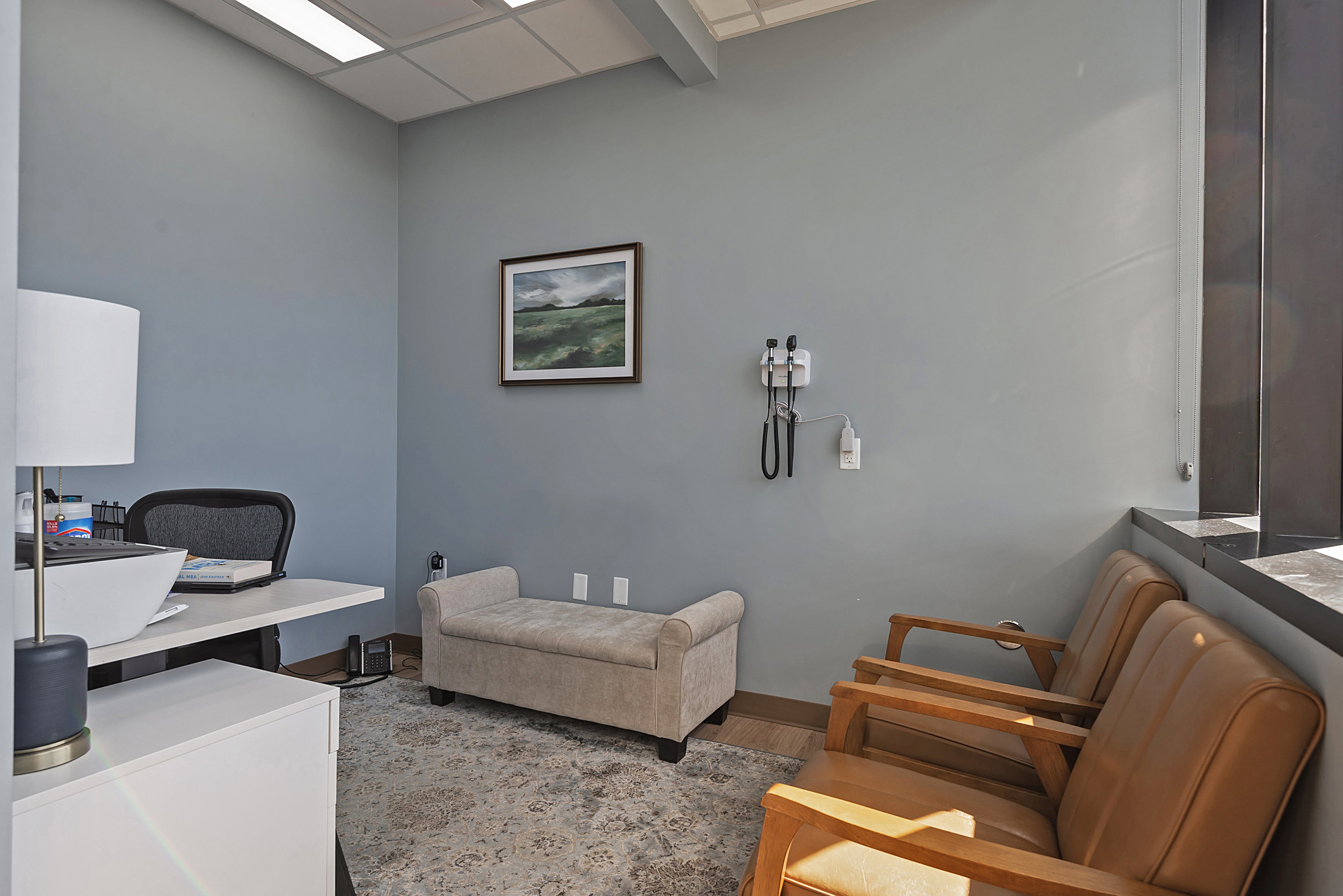 Office space with a paneled ceiling