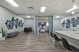 Office with a paneled ceiling