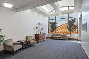 Community lobby featuring a high ceiling and recessed lighting