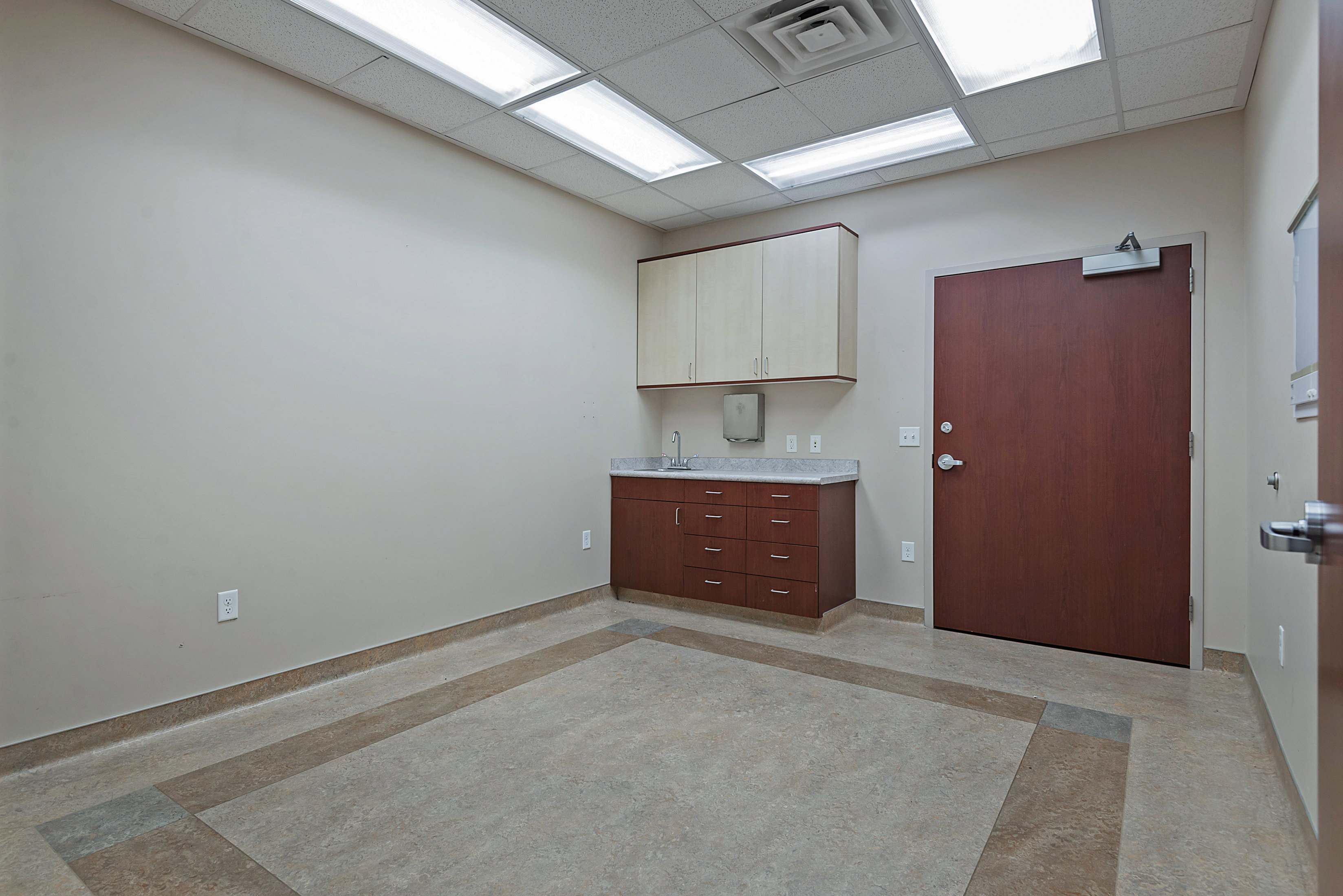 Kitchen featuring a drop ceiling and light countertops