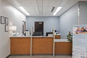 Welcome area featuring a drop ceiling