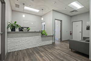 Welcome area featuring a drop ceiling