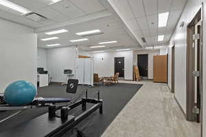 Workout room with a paneled ceiling
