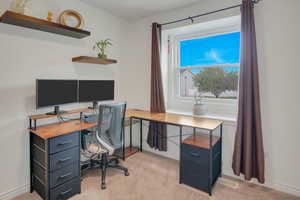 Office featuring light carpet