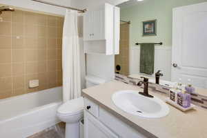 Bathroom with vanity and shower / bath combo