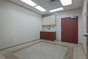 Kitchen featuring a drop ceiling and light countertops