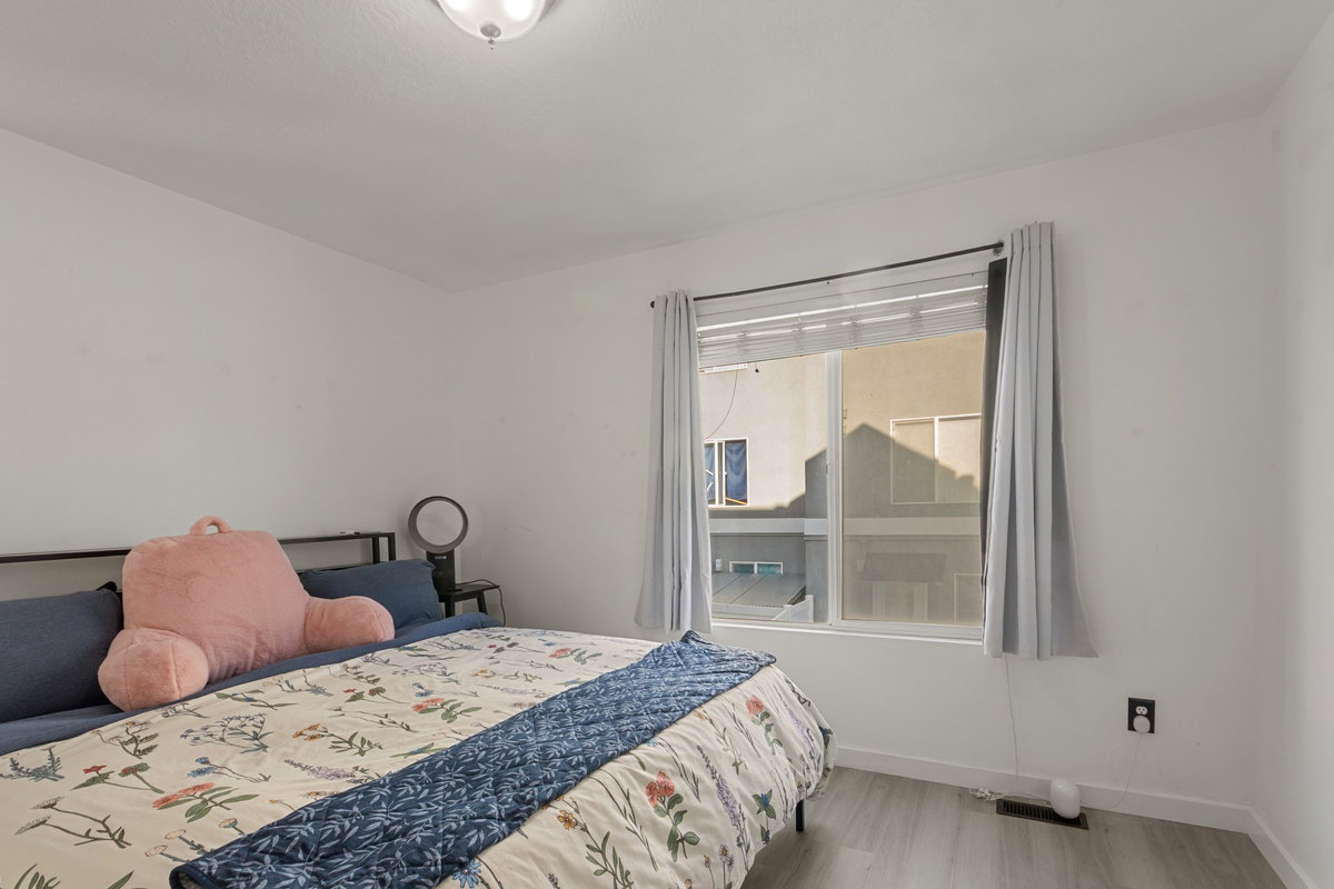 Bedroom featuring baseboards and light wood-type flooring