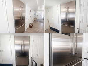 Kitchen with high quality fridge, built in fridge, and light wood-style floors