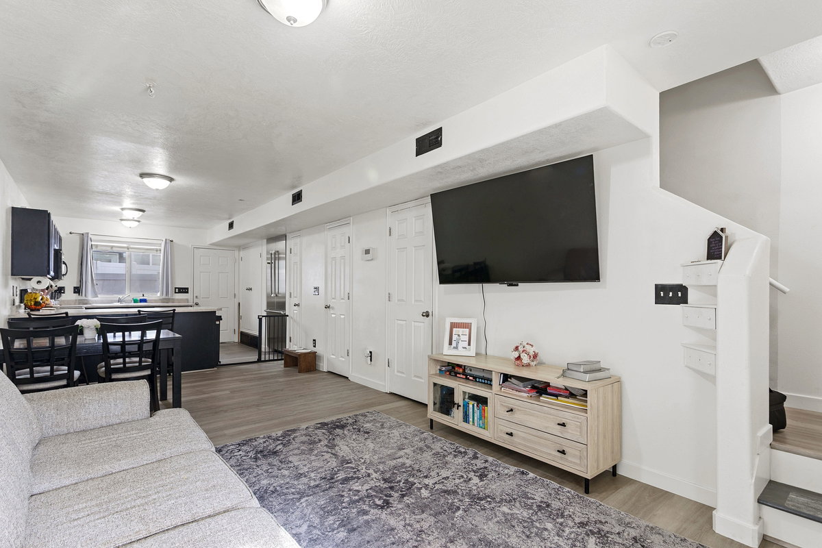 Living area with wood finished floors and baseboards