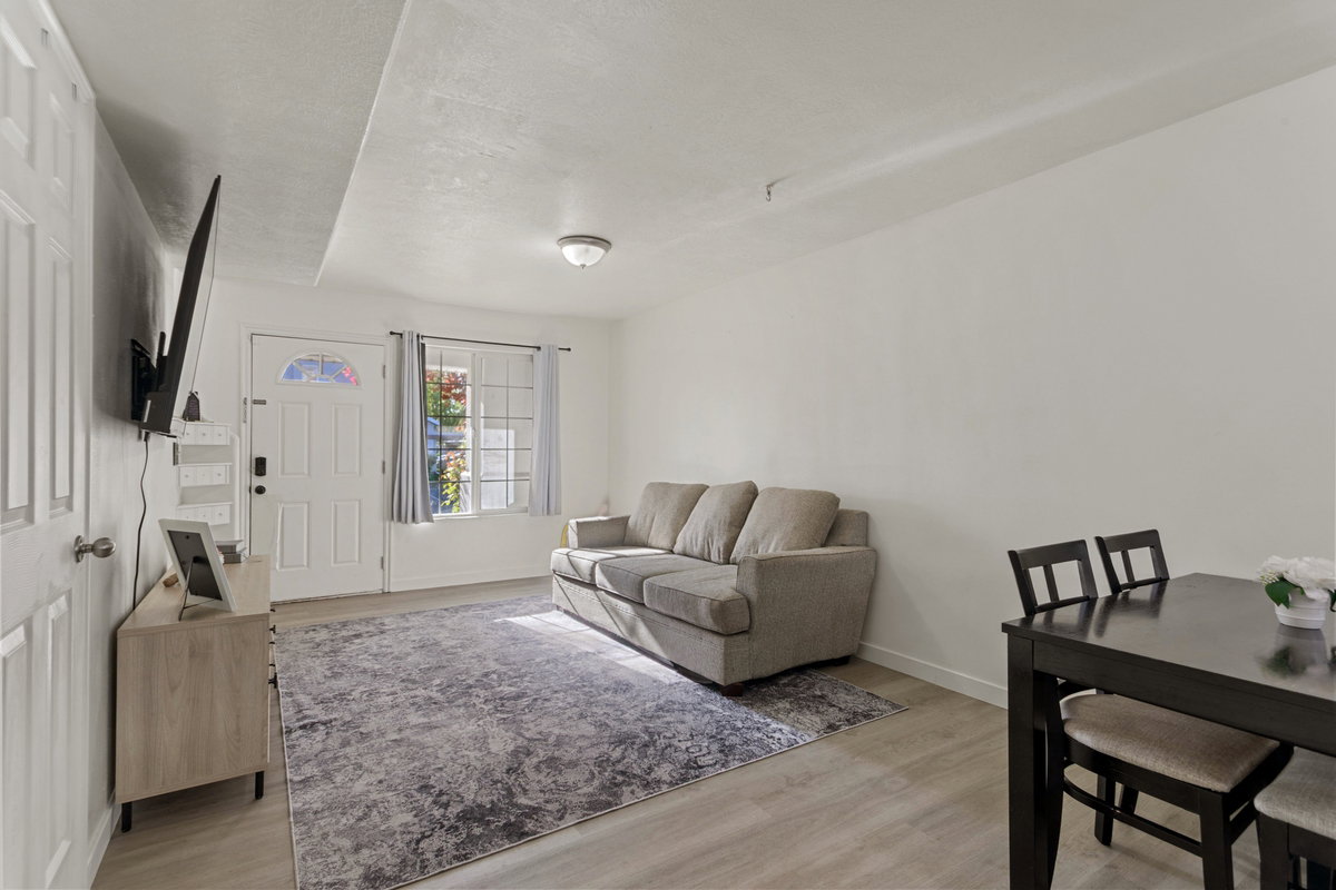 Living area featuring light wood-style floors and baseboards
