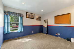 Spare room with carpet floors and recessed lighting
