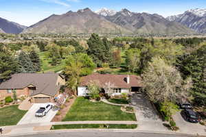 View of subject property with a mountain backdrop