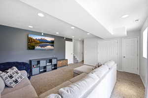 Living area featuring carpet and recessed lighting