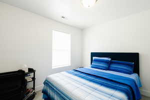 Bedroom featuring carpet flooring and baseboards