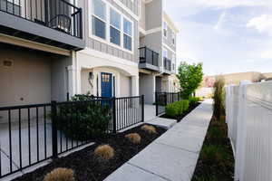View of home's community with a balcony
