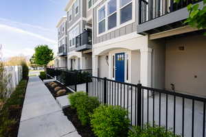 View of home's community with a balcony
