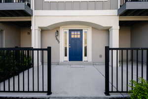 Entrance to property featuring board and batten siding and stucco siding