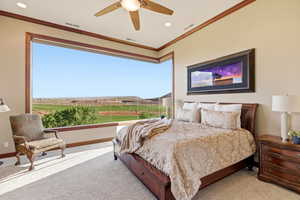 Bedroom featuring ceiling fan, light colored carpet, ornamental molding, and recessed lighting