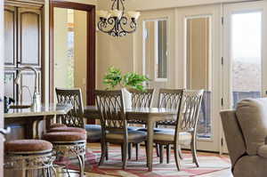 Dining space with a chandelier and plenty of natural light