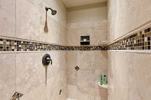 Bathroom featuring a tile shower