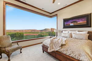 Bedroom with light carpet, a ceiling fan, ornamental molding, and recessed lighting