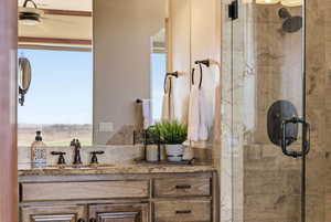 Bathroom with vanity and a stall shower