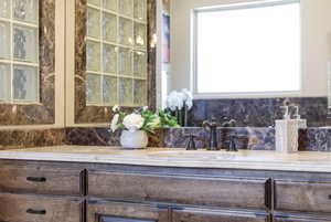 Full bath featuring vanity