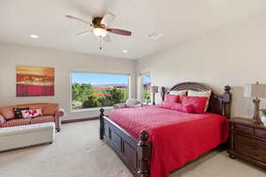 Bedroom with light colored carpet, a ceiling fan, and recessed lighting