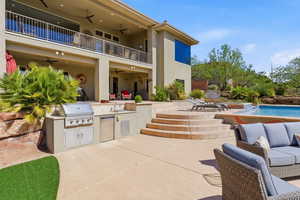 Patio / terrace with an outdoor kitchen with living area, a patio area, ceiling fan, and an outdoor pool