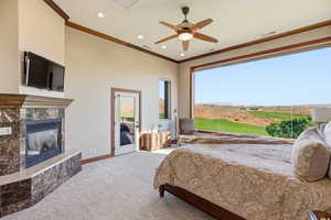 Bedroom with a premium fireplace, access to outside, ornamental molding, carpet, and recessed lighting