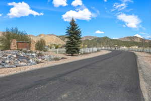 View of asphalt street with a mountain view