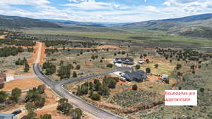 View of rural area featuring property boundaries highlighted and mountains (boundaries are approximate)