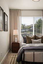 Carpeted bedroom with baseboards