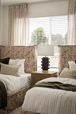 Bedroom featuring multiple windows