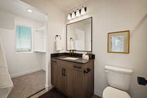 Full bath with vanity and recessed lighting