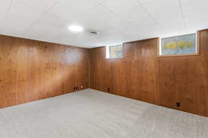 Basement with carpet flooring
