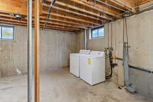 Below grade area featuring separate washer and dryer