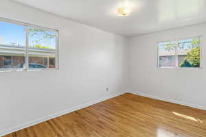 Empty room featuring light wood finished floors