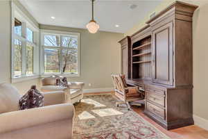 Office with baseboards and recessed lighting