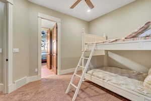 Bedroom with light colored carpet, a ceiling fan, and recessed lighting