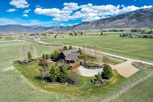 View of rural area featuring a pastoral area and a mountain backdrop