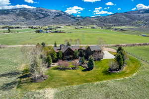 Overview of rural landscape with a pastoral area and a mountainous background