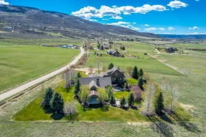 View of rural area featuring agricultural land and a mountainous background