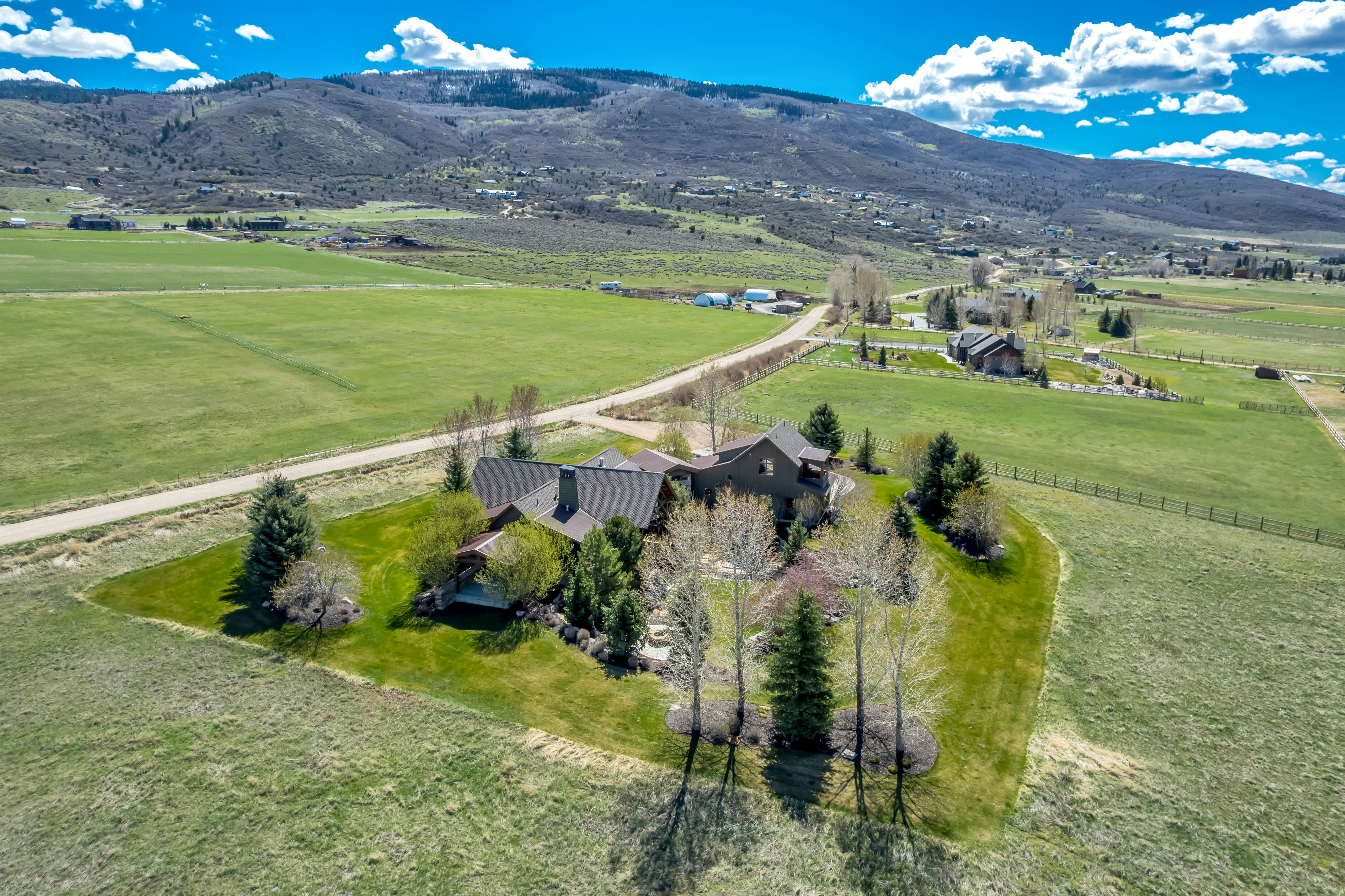 Aerial view of sparsely populated area with a mountainous background